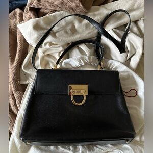 Black Ferragamo Top Handle Bag with removable shoulder strap.